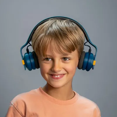 boy wearing midnight berry kibu headphones